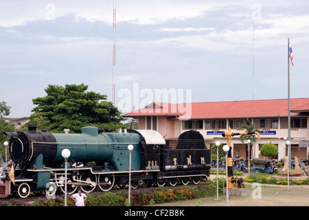 An old steam locomotive is a popular tourist attraction at the train station in Khorat, Thailand. Stock Photo