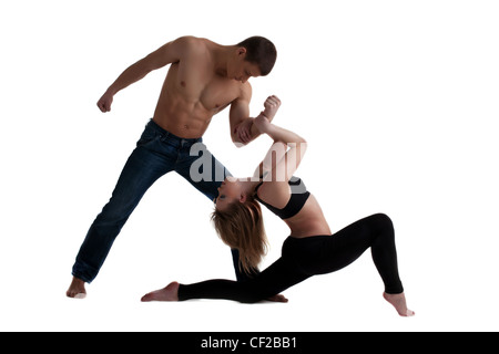 Couple of young gymnast posing in dance performance isolated Stock Photo