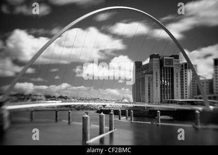 The Baltic Gallery in Gateshead, with the Millennium Bridge crossing the River Tyne.