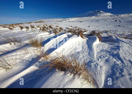 Snow covering Pen-y-ghent, a fell in the Yorkshire Dales and one of the Yorkshire Three Peaks, in winter. Stock Photo