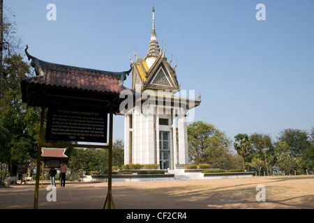 A memorial marked by a Buddhist stupa is filled with over 5,000 human skulls at Killing Fields Museuin in Phnom Penh, Cambodia. Stock Photo