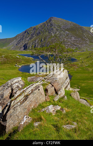 View of Pen Yr Ole Wen, the seventh highest mountain in Snowdonia and in Wales, from a path above Llyn Idwal in Snowdonia. Stock Photo