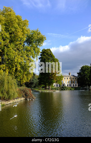 View across the Palm House Pond to Museum No. 1 at the Royal Botanic Gardens Kew. Stock Photo