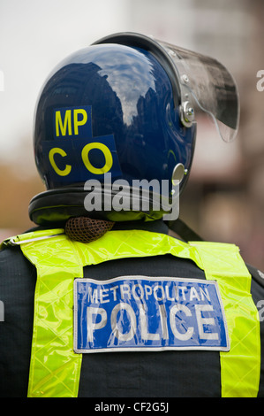 A mounted Metropolitan Police Officer wearing a riot helmet. Stock Photo