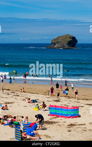 Holidaymakers enjoying the summer sunshine on the beach at Portreath in Cornwall. Stock Photo