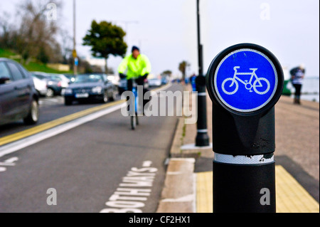 A sign indicating a cycle lane on the seafront at Southend-on-Sea. Stock Photo