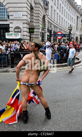 A participant in the Pride London Parade exposing his buttocks.