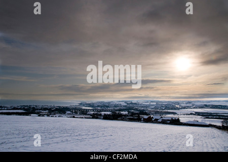 A snow covered landscape featuring Berwick upon Tweed from the site of the Battle of Halidon. During the Border Wars Berwick exc Stock Photo