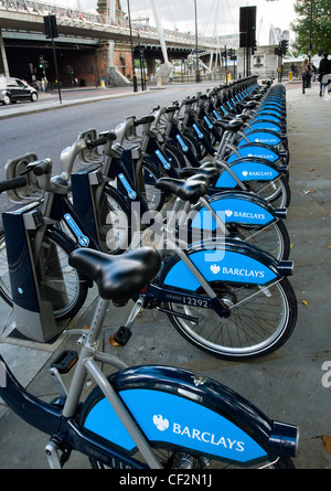 A row of bikes in a Barclays Cycle Hire docking station. Stock Photo
