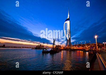 An early evening view of the 170m high Spinnaker Tower at Gunwharf Quays in Portsmouth Harbour. Stock Photo