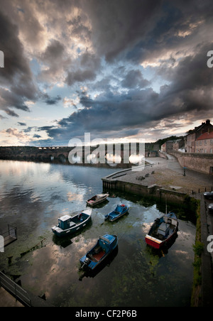 Sunset over the quayside at Berwick-upon-Tweed looking towards Berwick's three bridges. Stock Photo