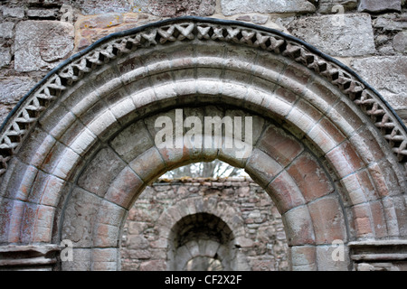 The top of a Norman arched doorway in the south wall of St Mary's Kirk, Auchindoir built circa 13th century. Stock Photo