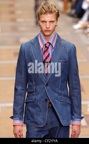 Sonia Rykiel Paris Menswear S S Male model wearing blue jeans suit with striped shirt and striped tie Stock Photo