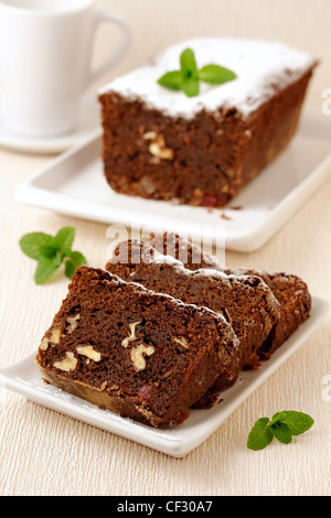 Chocolate and nuts plum cake. Recipe available. Stock Photo