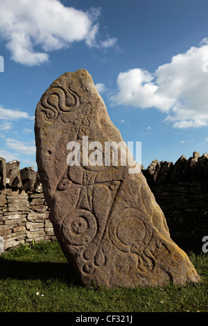 An Aberlemno sculptured stone featuring Pictish symbols of a serpent, a double disc and z-rod and a mirror and comb. Stock Photo