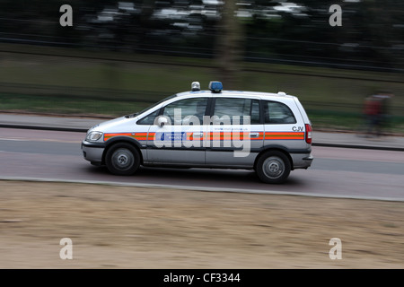 A police car traveling along a road in London Stock Photo