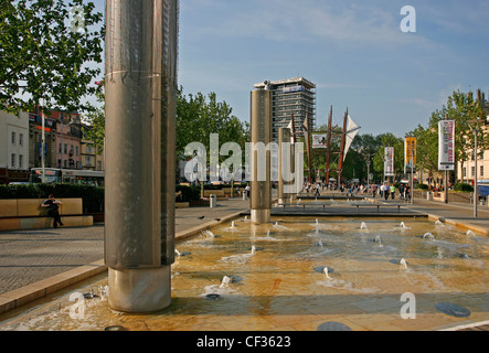 People relaxing and walking past the Millennium promenade in Bristol. Stock Photo