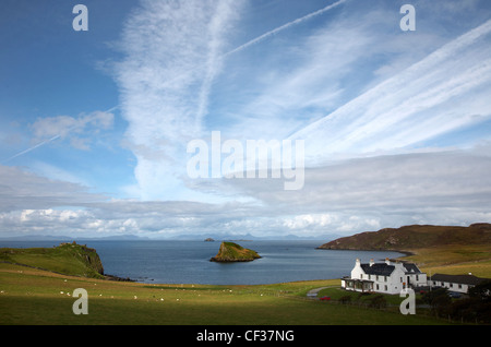 A view toward Tulm Bay with Tulm Castle and Duntulm Hotel and the Mountains of Harris in the distance. Stock Photo