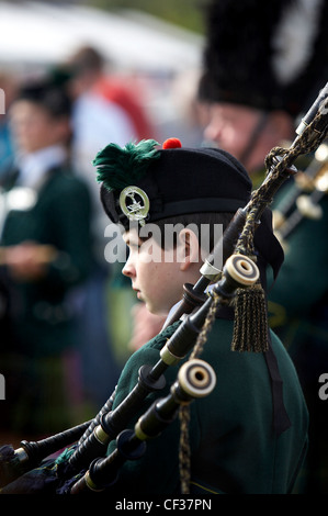 A boy piper at the Lonach Highland Games. Stock Photo