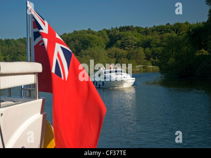 Boating along the River Yare, on the Norfolk Broads. Stock Photo