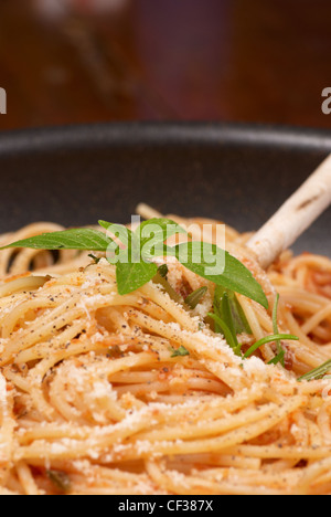 Freshly prepared homemade pasta in tomato sauce Stock Photo