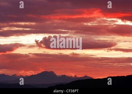 A dramatic red sunset over the Cuillin Hills on the Isle of Skye. Stock Photo