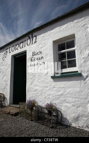 Exterior view of traditional text on the side of a Gaelic shop at Isleornsay. Stock Photo