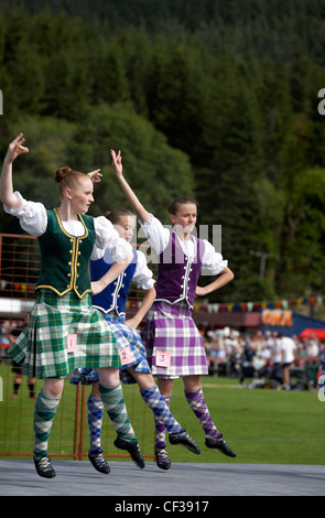 Young female highland dancers performing at the Lonach Highland Games. Stock Photo