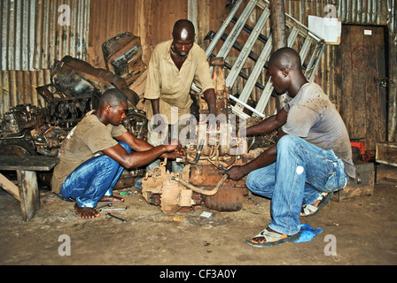 Mechanics at work in a garage in Bo, Sierra Leone Stock Photo