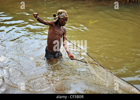 Young boy wading fishing net hi-res stock photography and images - Alamy