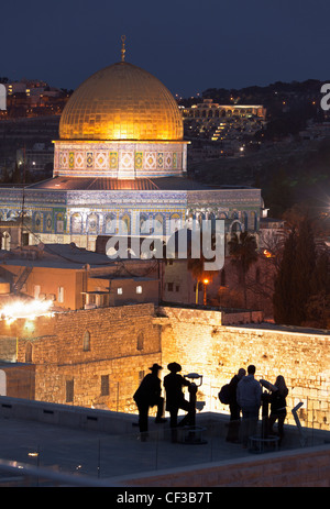 Israel,Jerusalem,people at an overview of the Dome of the Rock and the Wailing Wall at dusk Stock Photo