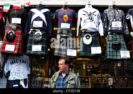 Tartan kilts and Scottish tops hanging outside a shop on The Royal Mile. Stock Photo