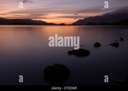 Sunset over Derwent Water from a jetty near Ashness Bridge. Stock Photo