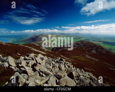 A wide view from the summit of Yr Eifl to the peaks of the Snowdon Range looking over the NW part of the Lleyn Peninsula, the co Stock Photo