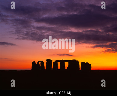 The Stonehenge trilithons silhouetted after sunset. Stock Photo