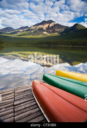 Three canoes on dock at Pyramid Lake, Jasper National Park, Alberta, Canada. Stock Photo