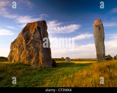 Avebury village lies within a massive Neolithic ritual complex surrounded by a stone circle contained by the ditch and bank of a Stock Photo