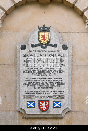 Memorial plaque to Sir William Wallace at St Bartholomew's Hospital, London, close to the place of his execution on the 23rd Aug Stock Photo