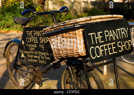 An old delivery bicycle in St Georges Park advertising The Pantry Coffee Shop. Stock Photo