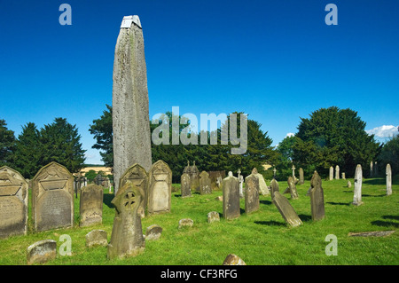 Rudston monolith, the tallest standing stone in the UK in the churchyard of All Saints Church. The megalith was erected around 1 Stock Photo