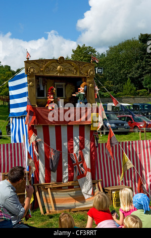 Young children enjoying a Punch and Judy at Gargrave Show, an annual country show near Skipton. Stock Photo
