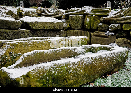 Roman stone coffins covered with snow in the Multangular tower in the Yorkshire Museum Gardens. Stock Photo