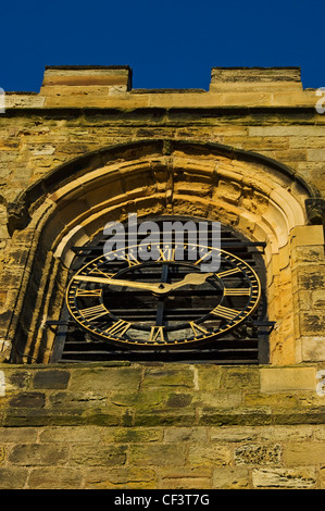 The clock face on the clock tower of St Mary's Church, the parish church of Whitby at the top of the 199 steps that lead up the Stock Photo