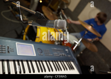 microphone near synthesizer. drummer in out of focus Stock Photo