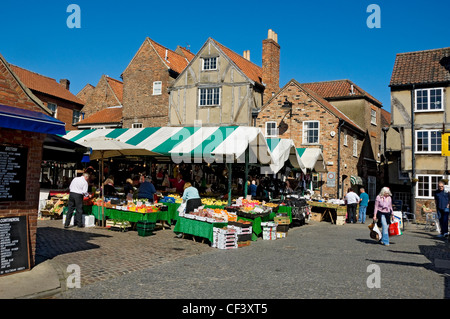 Fruit and vegetables for sale from stalls at Newgate Market. Stock Photo