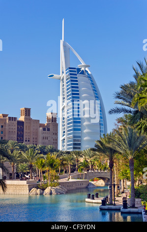 DUBAI Burj Al Arab building hotel Jumeirah beach United Arabien Emirates UAE blue sky architecture luxury luxus palm water blue Stock Photo