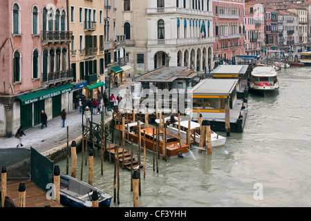 Vaporetto waterbus at Rialto stop on the Grand Canal - Venice, Venezia, Italy, Europe Stock Photo