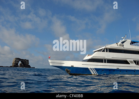 Divers boat by Darwin's Arch, Darwin Island, Galapagos Islands, Ecuador Stock Photo