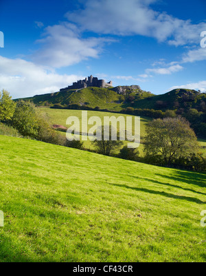 View across rolling hills towards Carreg Cennen Castle. Stock Photo