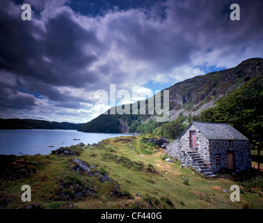 View across Llyn Geirionydd, a remote lake in Snowdonia as storm clouds gather overhead. Stock Photo
